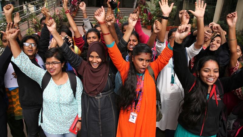 Indian students cheer  after all four men accused in the rape and murder of a Hyderabad veterinarian were killed by police officers, in Bangalore, India, on Friday. Photograph:. Jagadeesh Nv/EPA