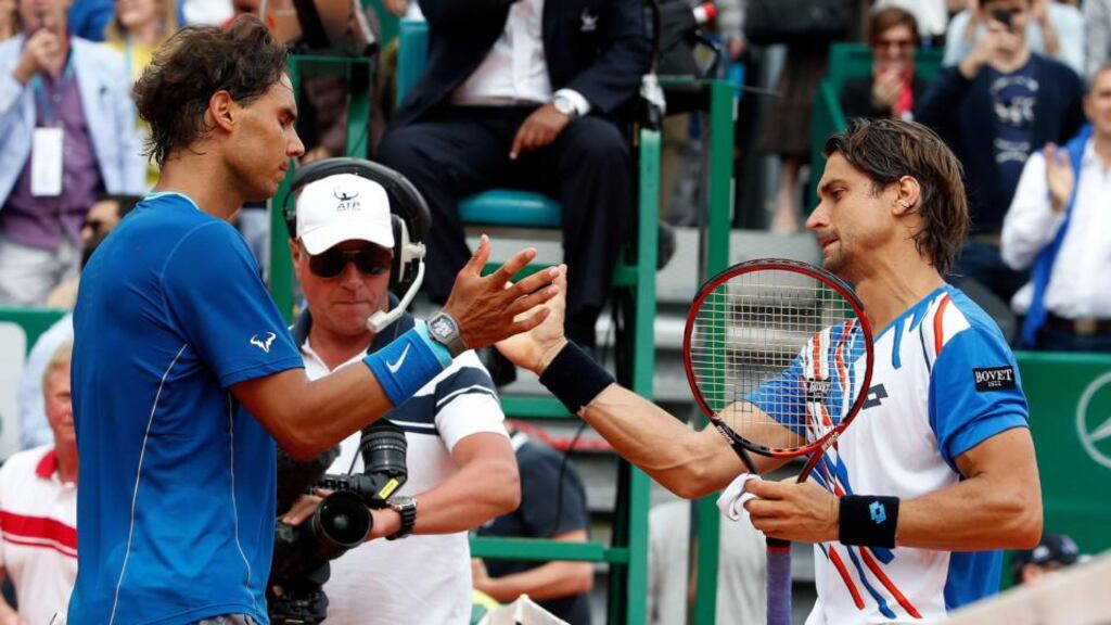 David Ferrer of Spain shakes hands with his compatriot Rafael Nadal after winning their quarter-final match at the Monte Carlo Masters. Photograph: Eric Gaillard/Reuters