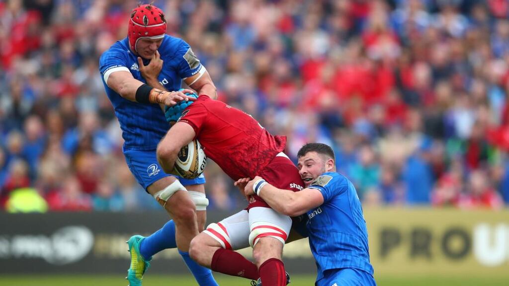 Leinster’s Josh van der Flier and Robbie Henshaw tackle Tadhg Beirne of Munster during the Guinness Pro 14 semi-final at the RDS. Photograph: James Crombie/Inpho