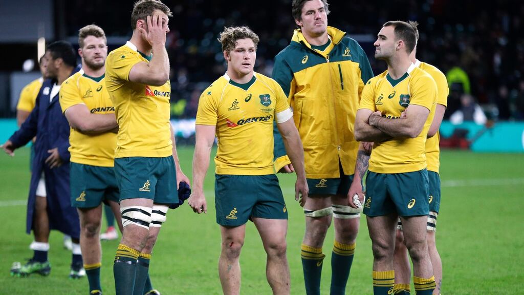 Dejected Australian players after their defeat to England at Twickenham. Photo: Henry Browne/Reuters