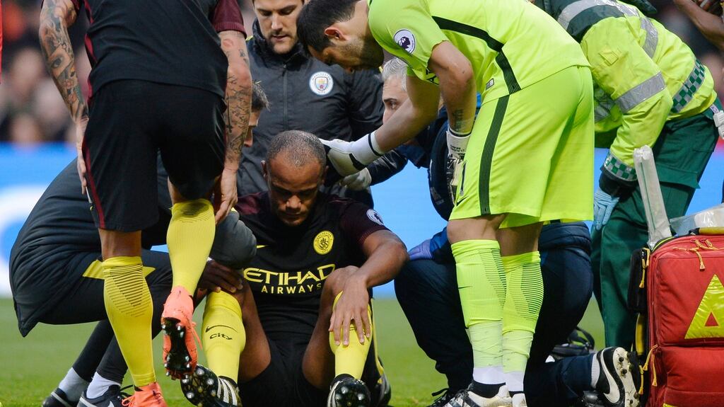Manchester City’s Vincent Kompany goes down with an injury against Crystal Palace. Photograph: Hannah McKay/Reuters