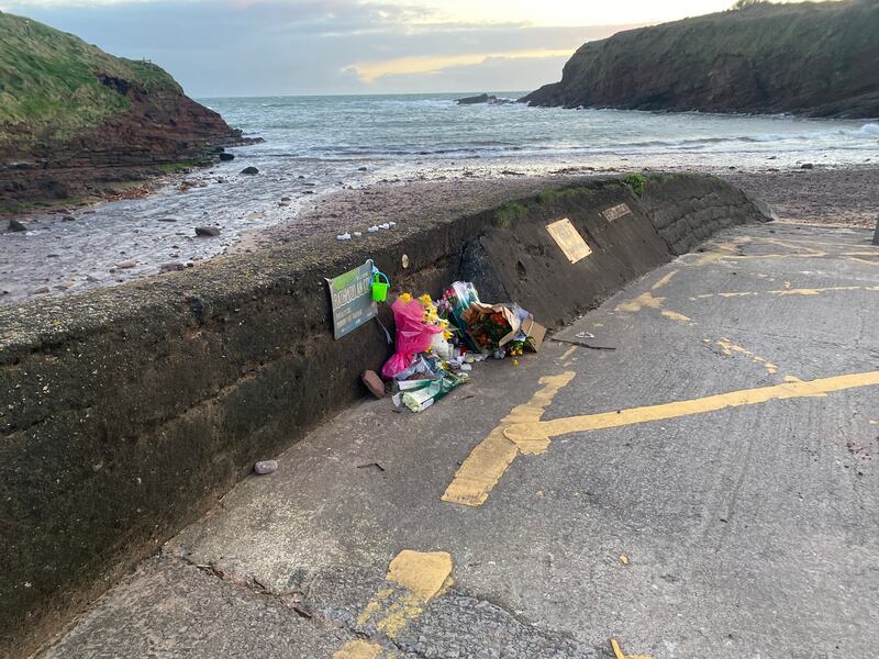 Flowers left at Rathmoylan Cove in Co Waterford on Monday. Matthew Healy (6) was found dead in a car at the secluded area a few miles from Dunmore East last Friday. Photograph: Fiachra Gallagher