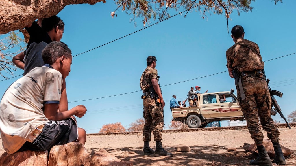 Ethiopian soldiers stand at Mai Aini refugee camp. Eritrean refugees fear their suffering may not be over. Photograph: Eduardo Soteras/AFP