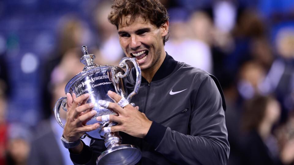 Rafael Nadal bites the trophy after winning the men’s singles final. Photograph: The New York Times