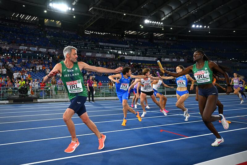 Adeleke passes the baton to teammate Barr. Photograph: Mattia Ozbot/Getty