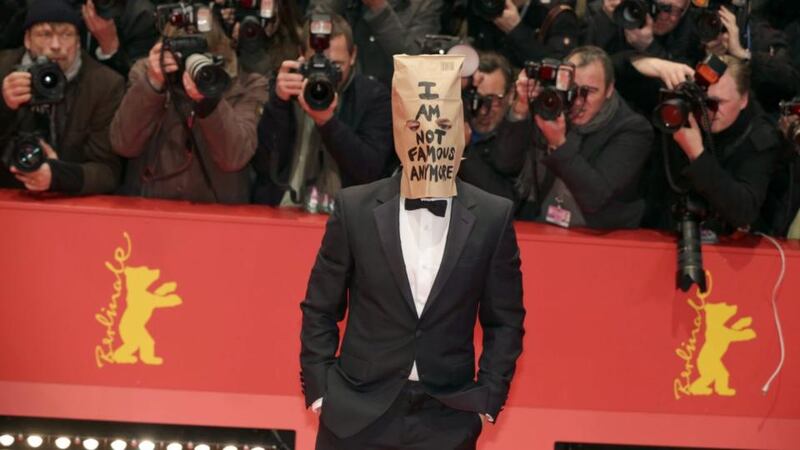 L is for la la land: American actor Shia LaBeouf with a paper bag over his head bearing the slogan ‘I am not famous any more’ (somebody should’ve told the photographers)