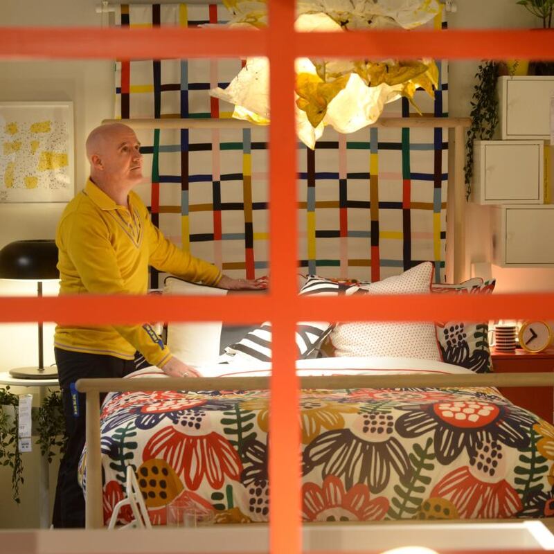 Ikea shift: Conor Pope in one of the store’s display bedrooms. Photograph: Dara Mac Dónaill