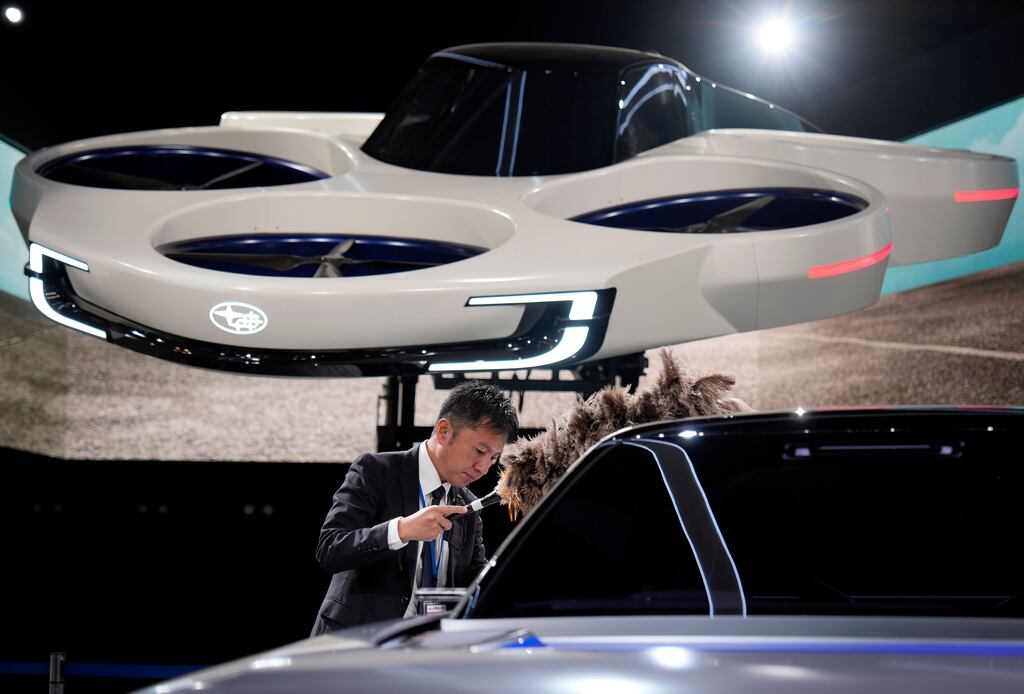 A Subaru Air Mobility concept in the background at the Japan Mobility Show 2023. Photograph: Franck Robichon/EPA