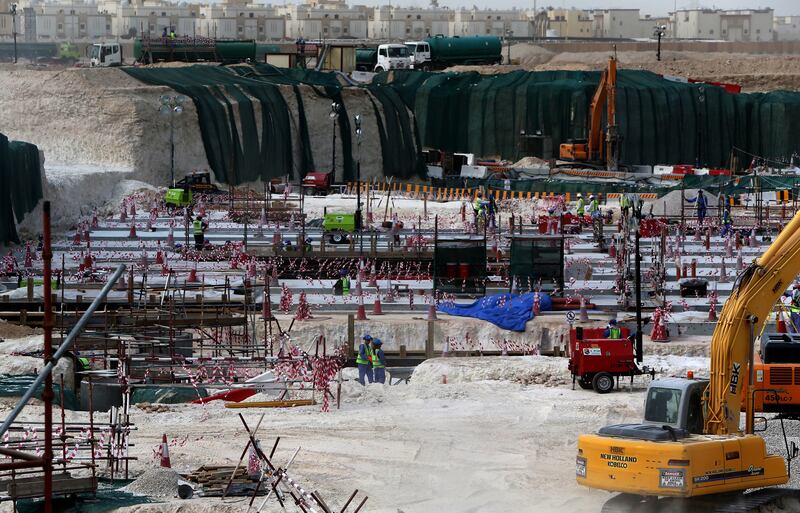 Foreign labourers work at the construction site of the al-Wakrah football stadium, one of the Qatar's 2022 World Cup stadiums, on May 4th, 2015, in Doha's Al-Wakrah southern suburbs. Photograph: Marwan Naamani/Getty Images