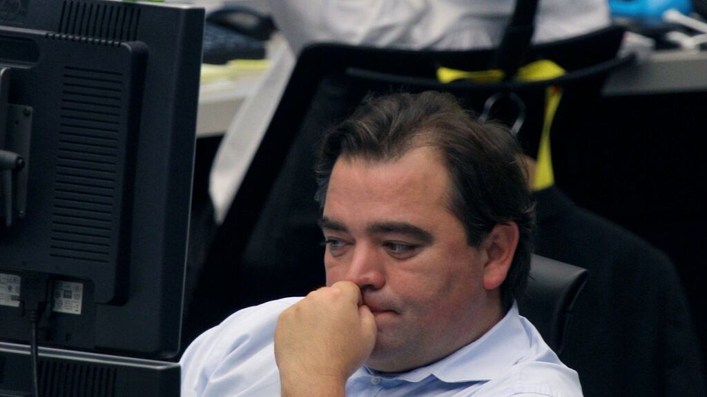 Financial traders react as they monitor their computer screens inside the Frankfurt Stock Exchange.  Photograph: Hannelore Foerster/Bloomberg