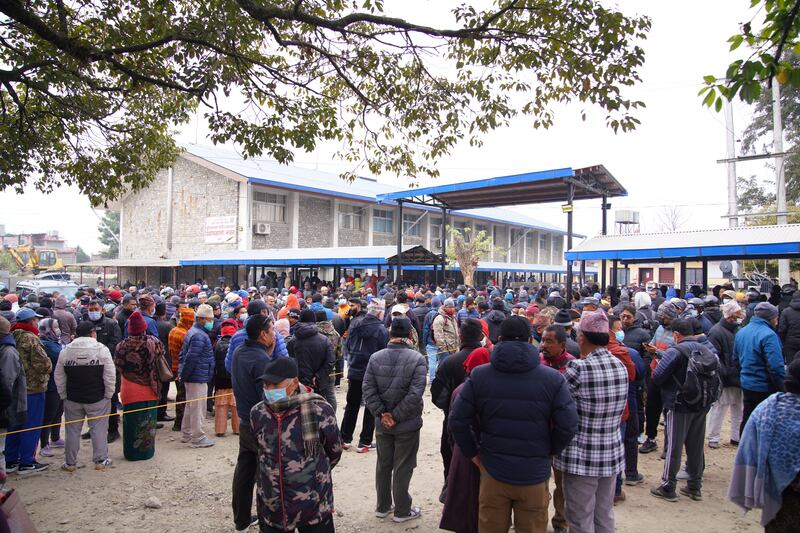 Family members of the crash victims wait outside the hospital mortuary in Pokhara, Nepal. Photograph: EPA