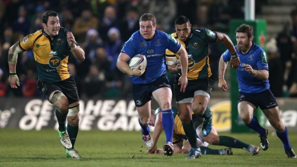 Leinster’s Seán Cronin is chased by Northampton’s Phil Dowson and Luther Burrel. Photograph: Billy Stickland/Inpho