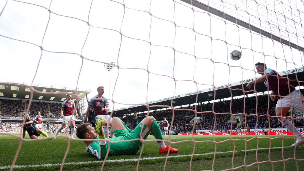Burnley’s Matthew Lowton tries to clear the shot from Manchester City’s Sergio Aguero during the Premier League clash. Photo: Andrew Yates/Reuters