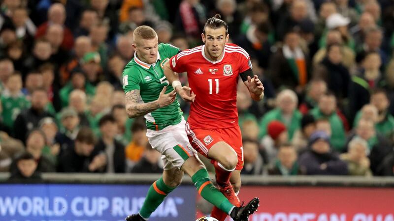 Ireland’s James McClean tackles Gareth Bale of Wales during the World Cup qualifier at the Aviva Stadium. Photograph: Morgan Treacy/Inpho