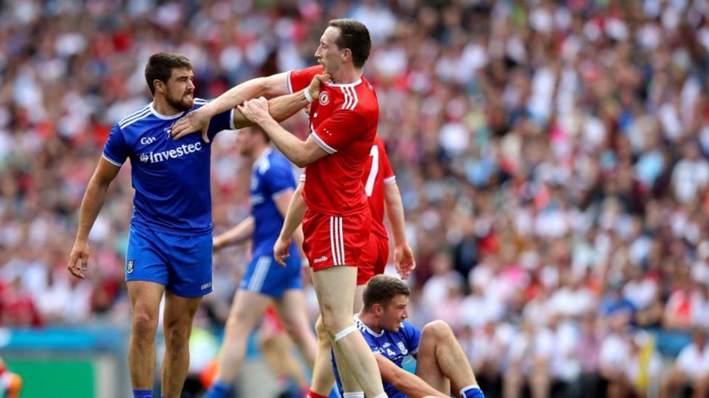 Monaghan’s Drew Wylie and Colm Cavanagh of Tyrone scuffle during the game. Photo: Ryan Byrne/Inpho