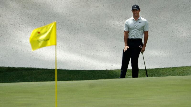 McIlroy pitches down the lightning fast 13th green on the way to a birdie. Photo: Jonathan Ernst/Reuters