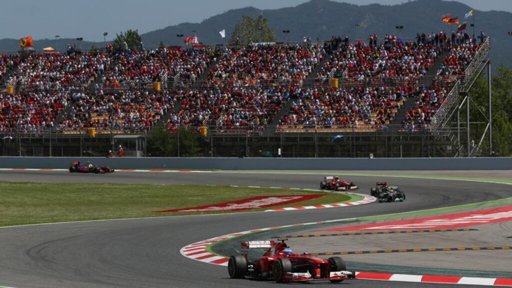 Ferrari driver Fernando Alonso on his way to winning the Spanish Formula One Grand Prix at the Circuit de Catalunya in Montmelo, Spain. Photograph: Clive Rose/Getty Images