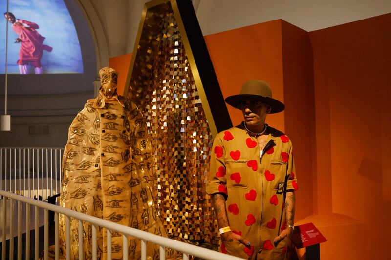 Moroccan fashion designer Artsi Ifrach next to his creation A Dialogue Between Cultures.