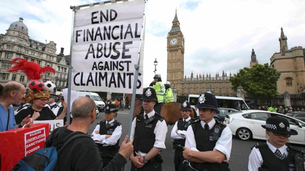 Demonstrators outside the House of Commons as UK chancellor George Osborne set out his plans to reshape the country’s economy with the first budget of the new Conservative government on Wednesday. Photograph: Paul Hackett/Reuters