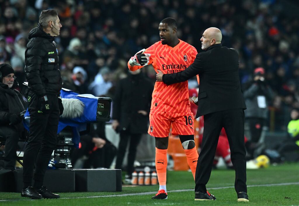 After suffering racist abuse from fans Mike Maignan of AC Milan interacts with head coach Stefano Pioli, during game against Udinese Calcio on January 20th. Photograph: Alessandro Sabattini/Getty