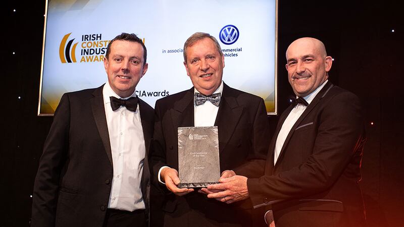 Paul Mangan, Awards Judge presents the Civil Contractor of the Year award to Morgan Sheehy & Peter Byrne, Roadbridge.