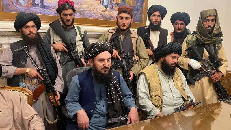 Taliban fighters take control of the Afghan presidential palace after President Ashraf Ghani fled the country, in Kabul, Afghanistan, on Sunday, night. Photograph: Zabi Karimi/AP Photo