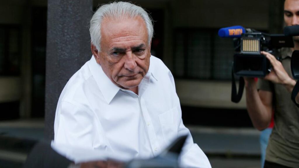Former IMF director Dominique Strauss-Kahnleaves his apartment in Paris yesterday. Photograph: Gonzalo Fuentes/Reuters
