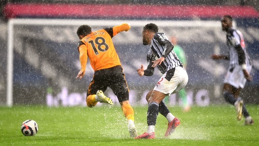 West Bromwich Albion’s Darnell Furlong and Wolverhampton Wanderers’ Morgan Gibbs-White battle for the ball in the rain during the Premier League match at The Hawthorns. Photo: Shaun Botterill/PA Wire