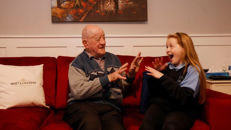A recovering Alf Sloan enjoys the company of his great granddaughter Adrianna McCarroll. Photograph: Alan Betson/The Irish Times