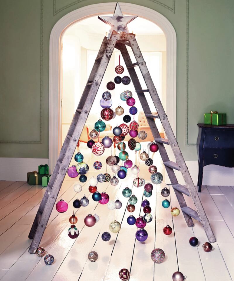 An open wooden ladder offers the right shape and height – simply festoon with baubles using fishing line, wire or thread