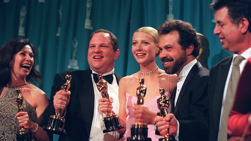 Harvey Weinstein, second from left, celebrates alongside the actress Gwynneth Paltrow and other producers of ‘Shakespeare in Love’ after their film won the best picture Oscar, in Los Angeles, March 22, 1999. (Monica Almeida/The New York Times)