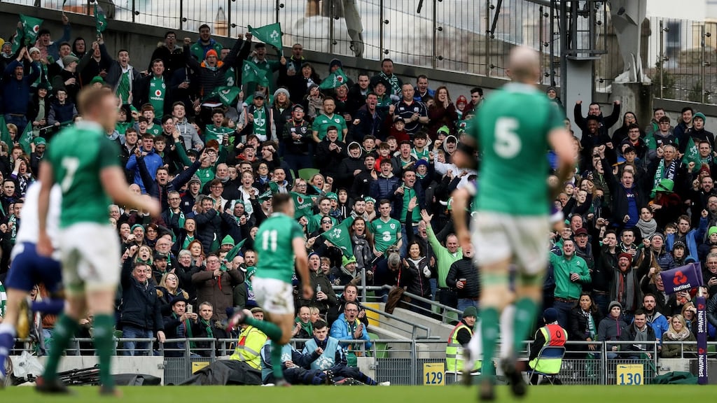 Ireland fans celebrate as Jacob Stockdale runs in to score an intercept try during their Six Nations win over Scotland. Photo: Tommy Dickson/Inpho