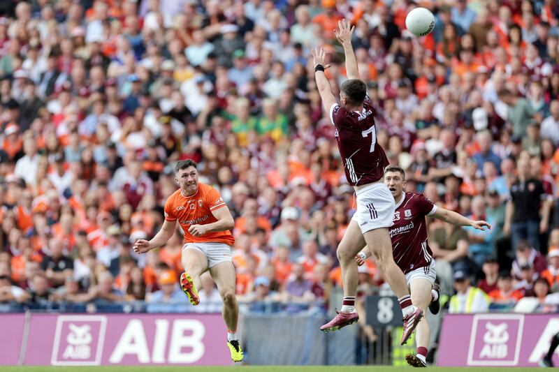 Armagh's Oisin Conaty scores a point despite Sean Ó Maoilchiaráin of Galway: Photograph: Laszlo Geczo/Inpho
