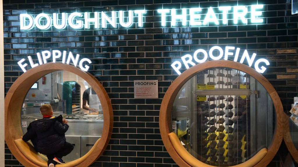 A curious customer at Krispy Kreme, Blanchardstown, Dublin. Photograph: Dara Mac Dónaill