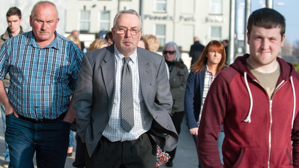 Conor Hickey’s father John Hickey (centre) with friends and family leaving Dublin Circuit Criminal Court on Wednesday. Photograph: Collins Courts