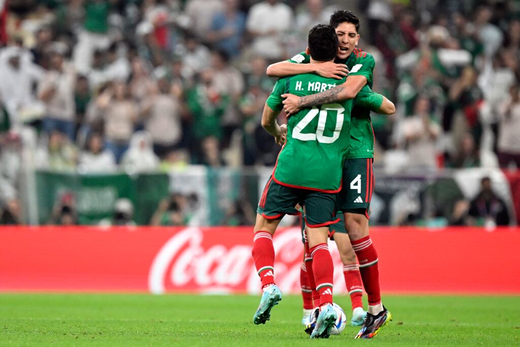 Henry Martin celebrates with Mexico team-mate Edson Alvarez after scoring his team's first goal against Saudi Arabia at the Lusail Stadium. Photograph: Alfredo Estrella/AFP via Getty Images