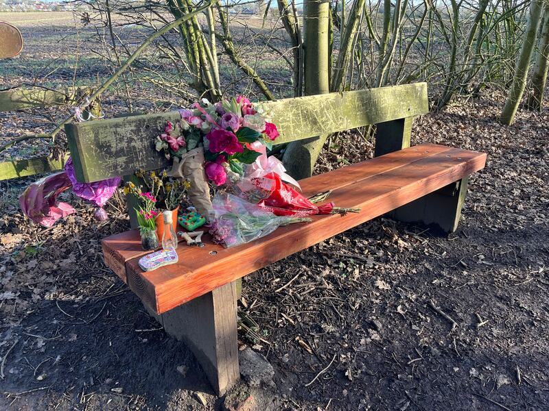 Flowers and tributes on a bench in the park where Brianna Ghey was murdered. Photograph: Mark Paul