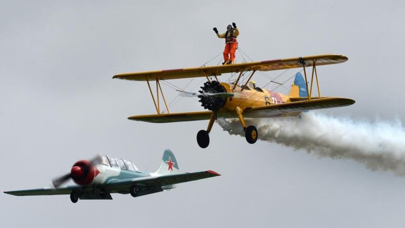 Tom Lackey (93) in action on the wings of a biplane. Photograph: Charles McQuillan/PA Wire