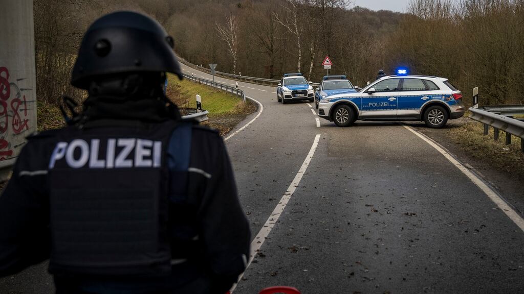 Police officers block a road leading to the scene of a shooting that left two police officers dead in Ulmet, Germany on Monday. Photograph: Thomas Lohnes/Getty Images