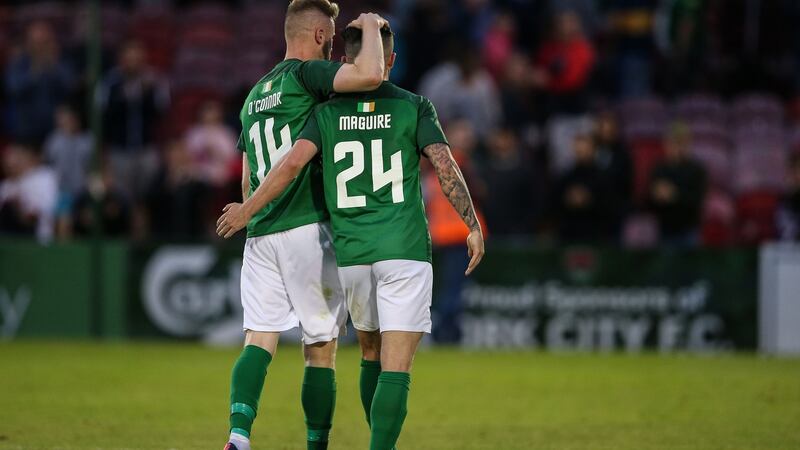Kevin O’Connor and Sean Maguire wave goodbye to Turner’s Cross after the match. Photo: Cathal Noonan/Inpho