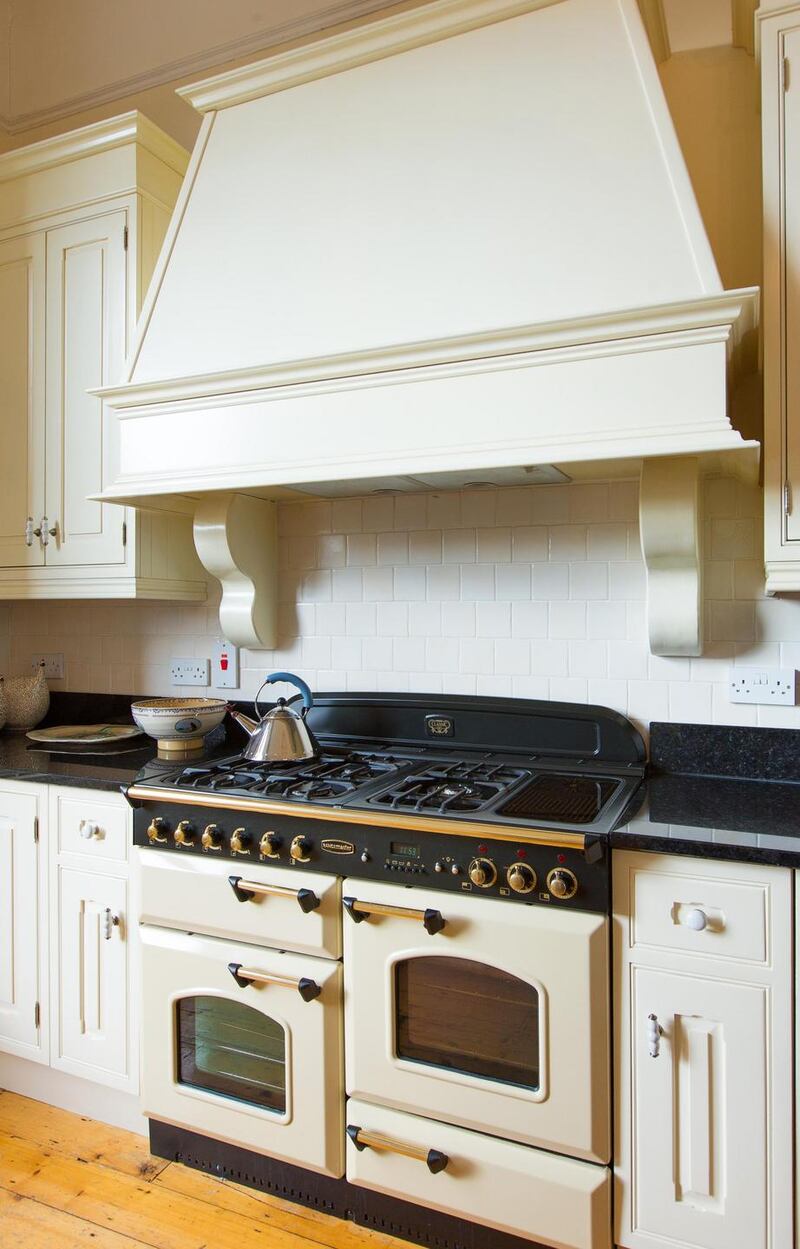 The kitchen is sensibly placed at hall-floor level at the back of the house