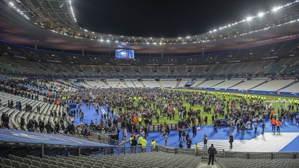 People on the Stade De France pitch following last year’s terrorist attacks. Photograph: Getty