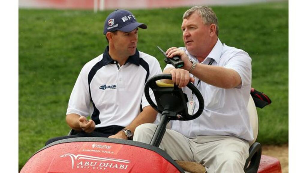 Padraig Harrington arrives for a press conference this morning with European Tour referee Andy McFee. Photograph: Ross Kinnaird/Getty Images