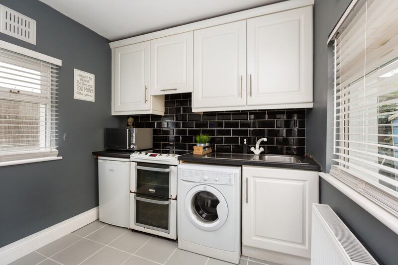 The kitchen is located to the rear.