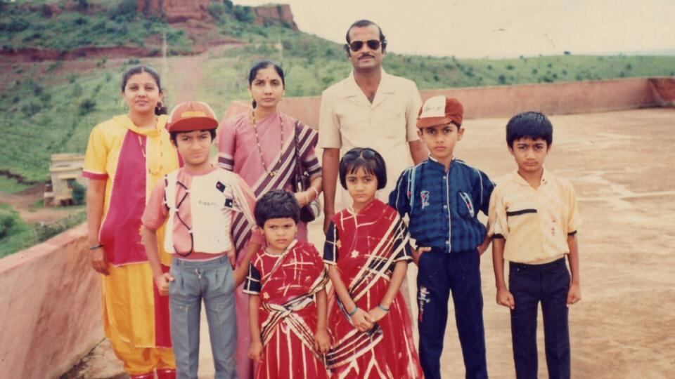 Changing faces: Savita on a family holiday in 1989, when she was about eight years old