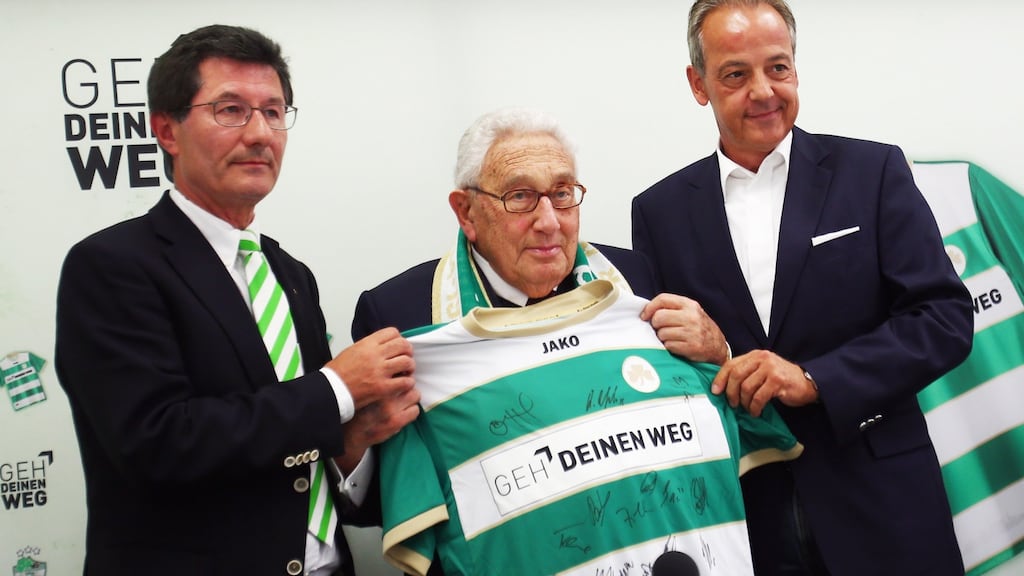 Henry Kissinger  poses with Fürth president Helmut Hack (left) and businessman  Peter M Endres before  the Bundesliga match between SpVgg Greuther Fürth and  Schalke 04 in September 2012. Photograph:  Getty Images