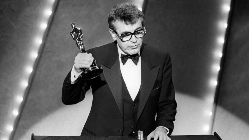 Milos Forman after winning the best director Oscar for holds up his Oscar for his film Amadeus in 1985. Photograph: AFP/Getty Images