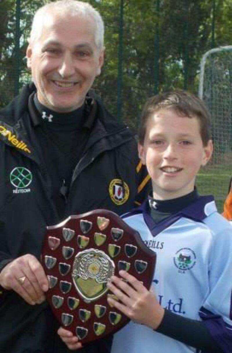 Charlie Smyth with his father, Leo. Photograph: Mayobridge GAA