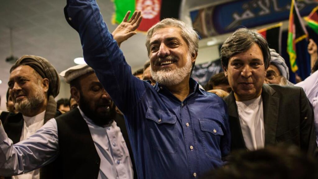 Abdullah Abdullah (centre) at a Kabul rally yesterday at which supporters urged him to form his own government. Photograph: Diego Ibarra Sanchez/New York Times
