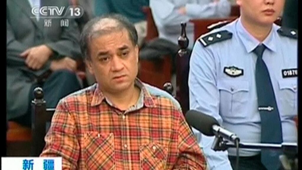 Uighur academic Ilham Tohti sits during his trial on separatism charges in Urumqi, Xinjiang region last week. A series of attacks occurred in Xinjiang two days before the Beijing-based scholar was jailed for for separatism, sparking an international outcry. Photograph: CCTV via Reuters.
